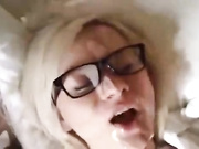After giving a handjob she gets a cumshot on her glasses
